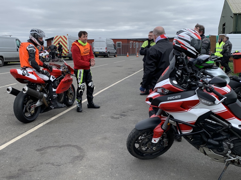 PECAM Members having a debrief from instructor Alex